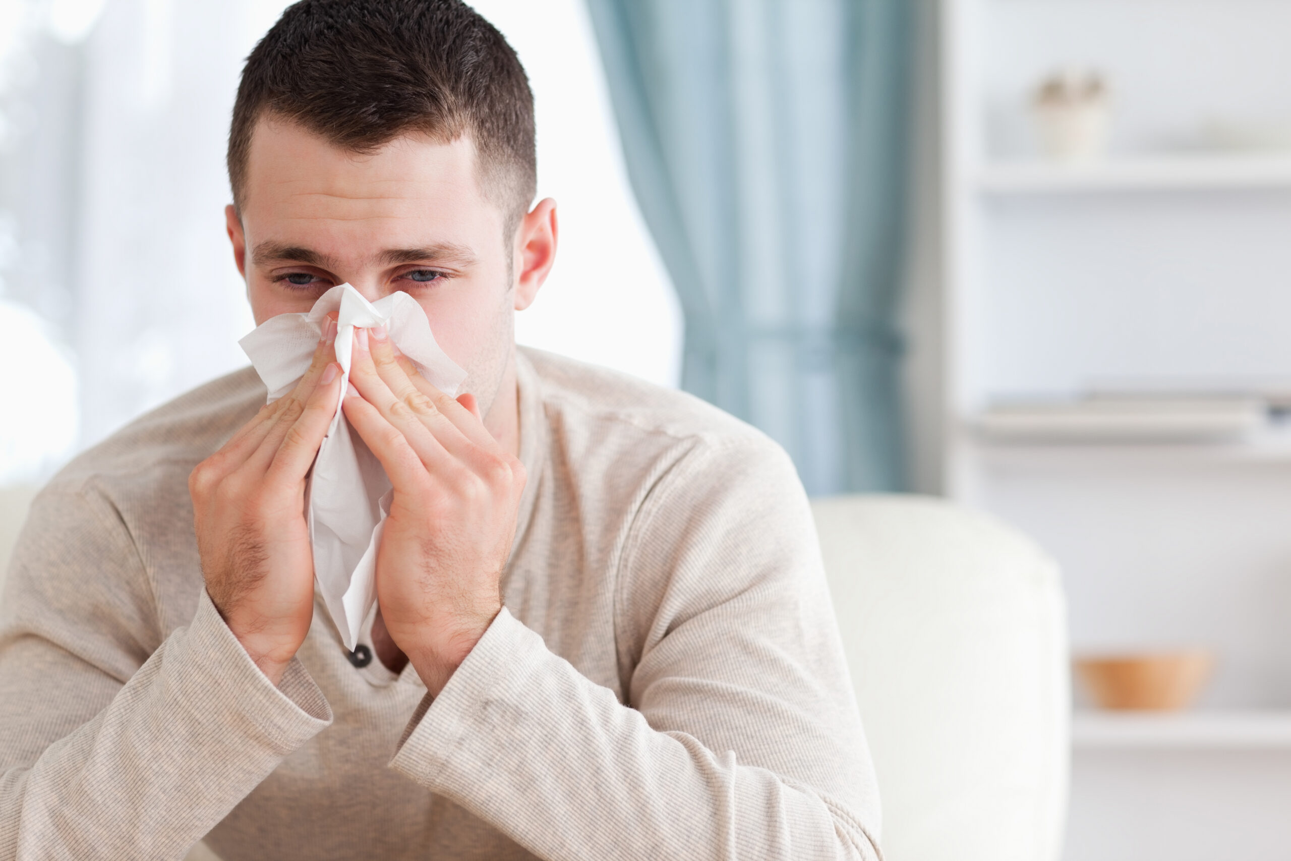 man suffering from allergies